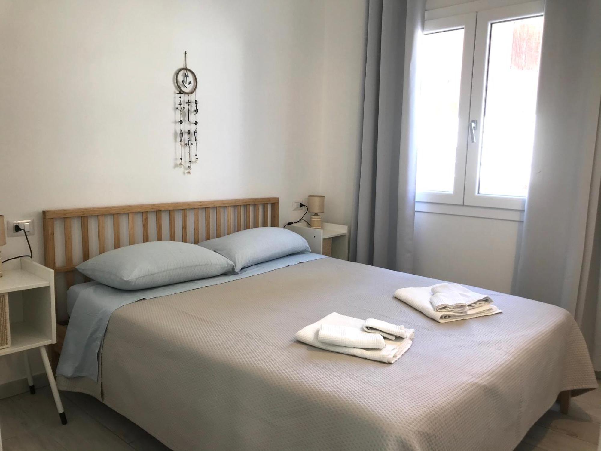 Case Vacanze "Bianco Mare" Porto Pino Ruang foto