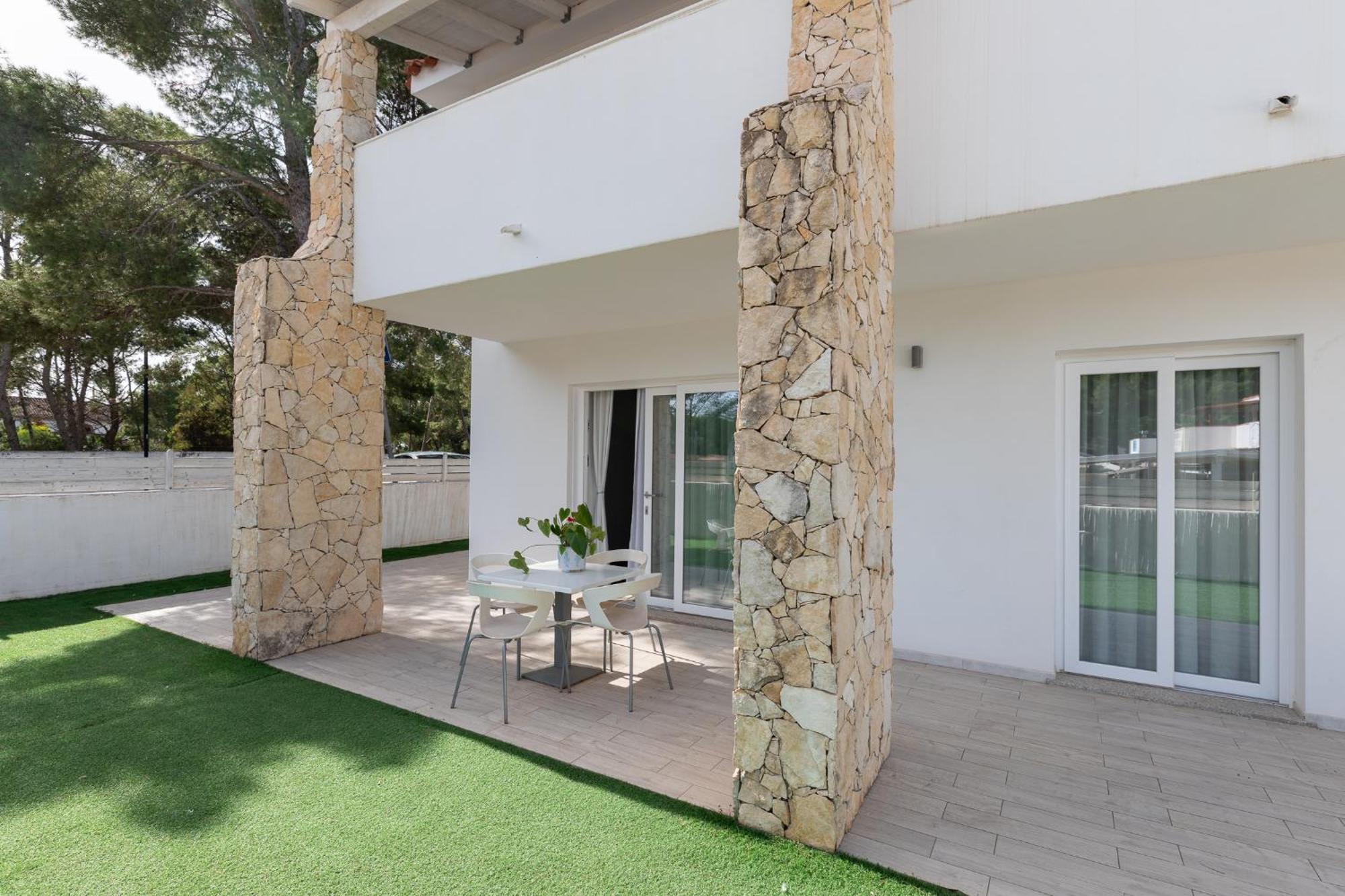 Case Vacanze "Bianco Mare" Porto Pino Ruang foto