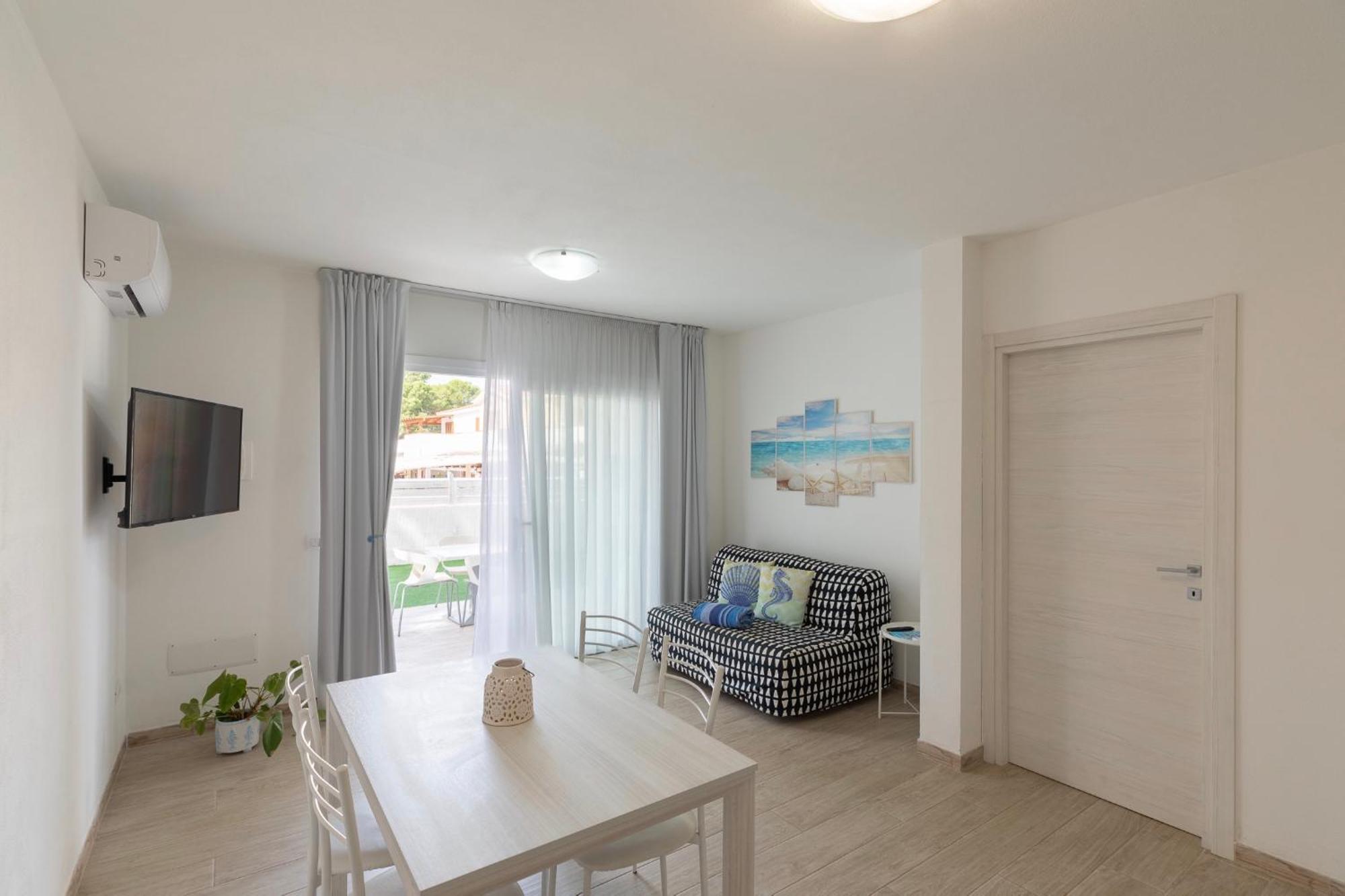 Case Vacanze "Bianco Mare" Porto Pino Ruang foto