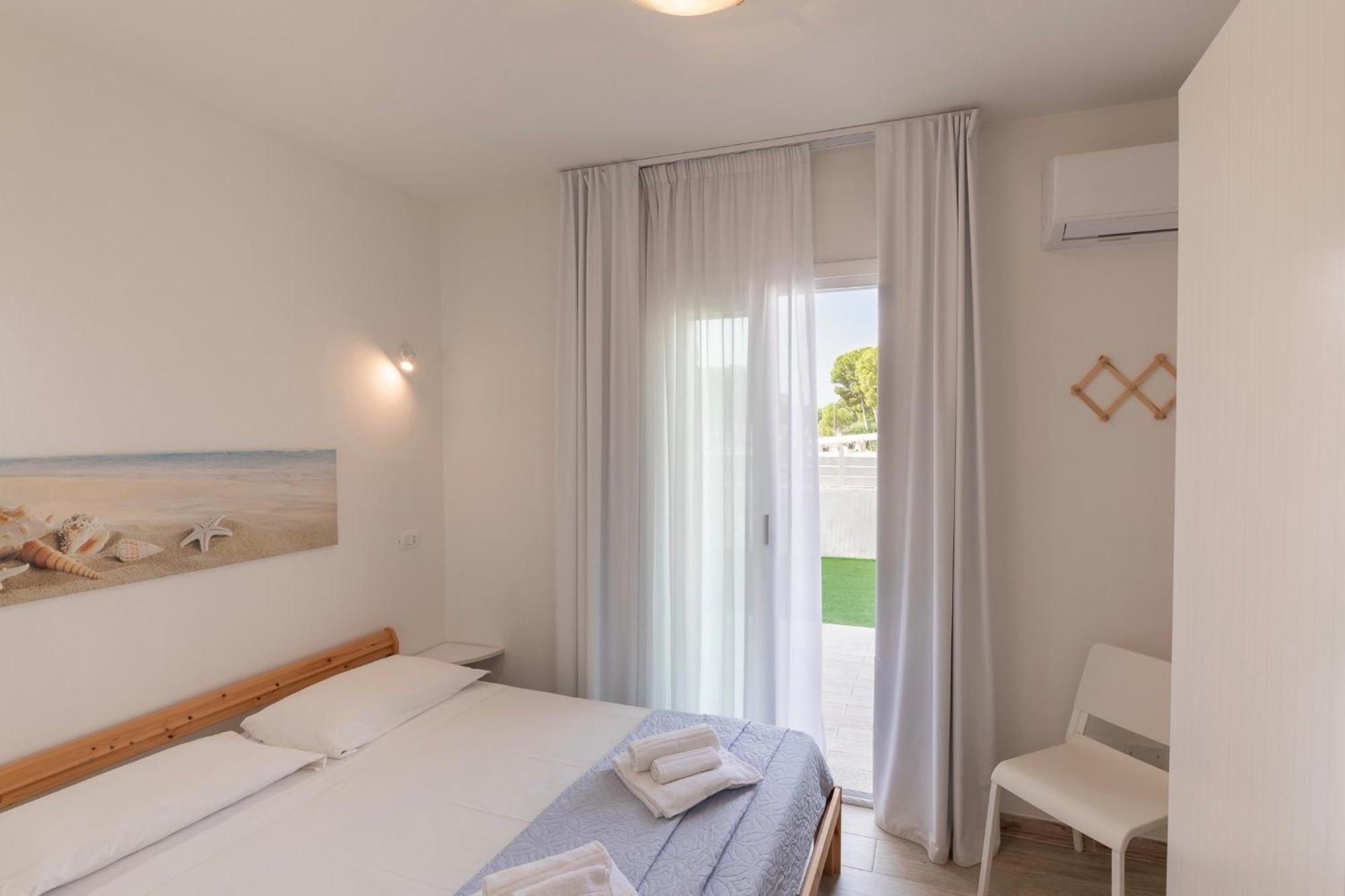 Case Vacanze "Bianco Mare" Porto Pino Ruang foto